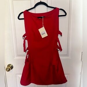 Red mini dress with silver buckles on the side